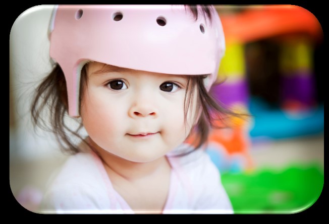 Young girl with a helmet on.