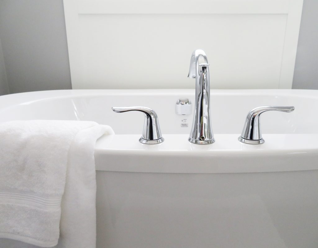 Image of a bath with a white towel.